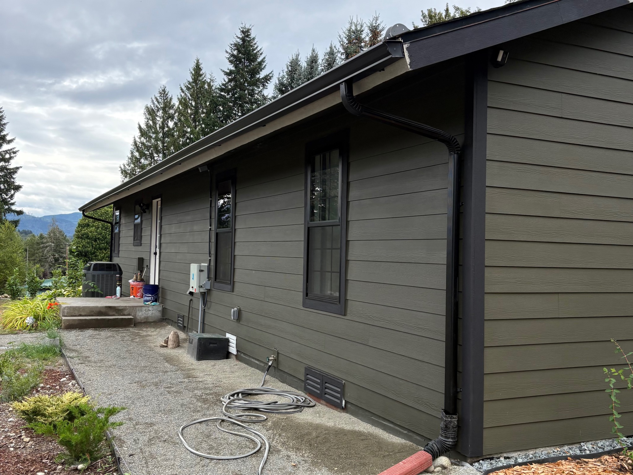 Completed horizontal siding with dark trim